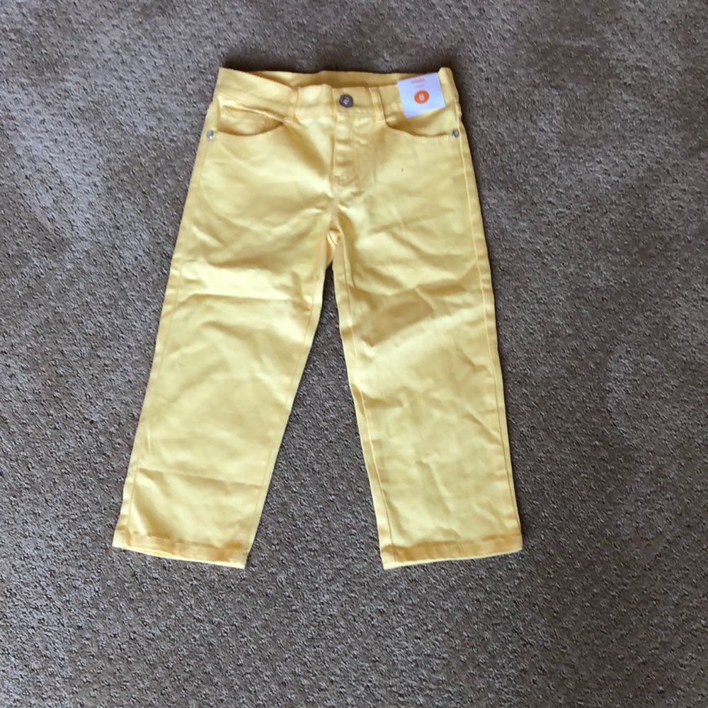Yellow capris.